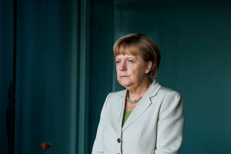  Angela Merkel Tieħu Żewġ Dożi Tal-Vaċċin Differenti